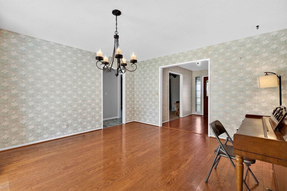 913 Ridgemark Drive Hollister, CA 95023 - Photo 9 of 75 a view of a livingroom with a furniture wooden floor and a ceiling fan