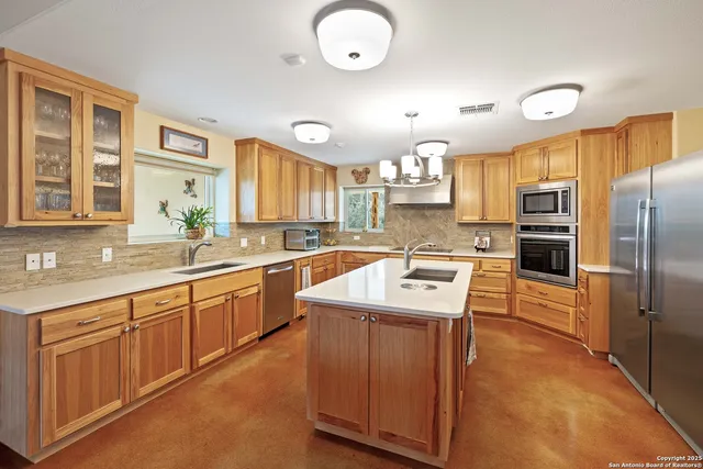 a kitchen with cabinets and window