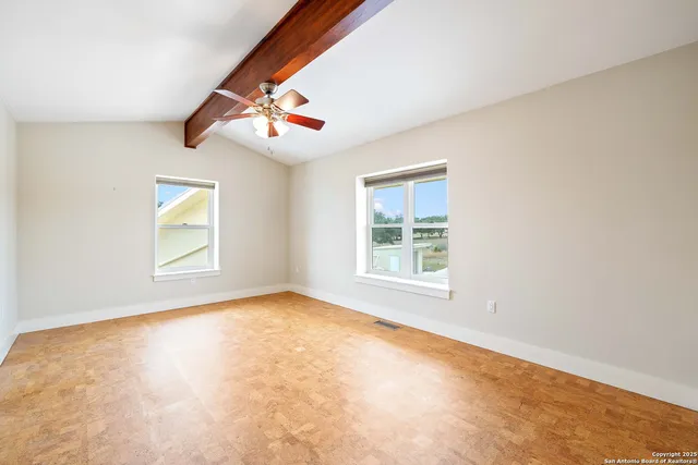 an empty room with windows