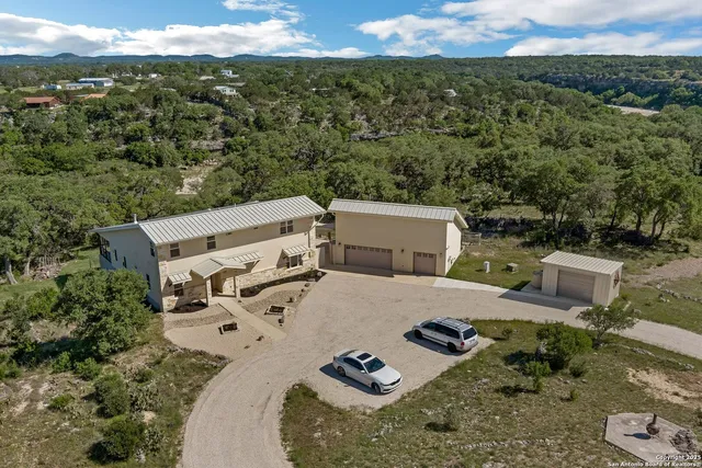 a view of a terrace with a table and chairs