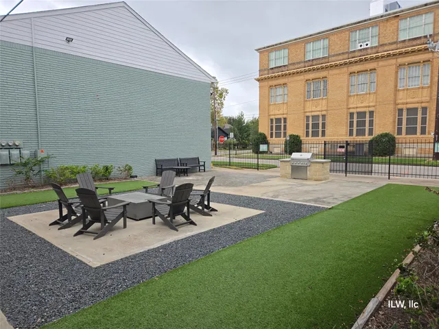 a view of a backyard with sitting area and furniture
