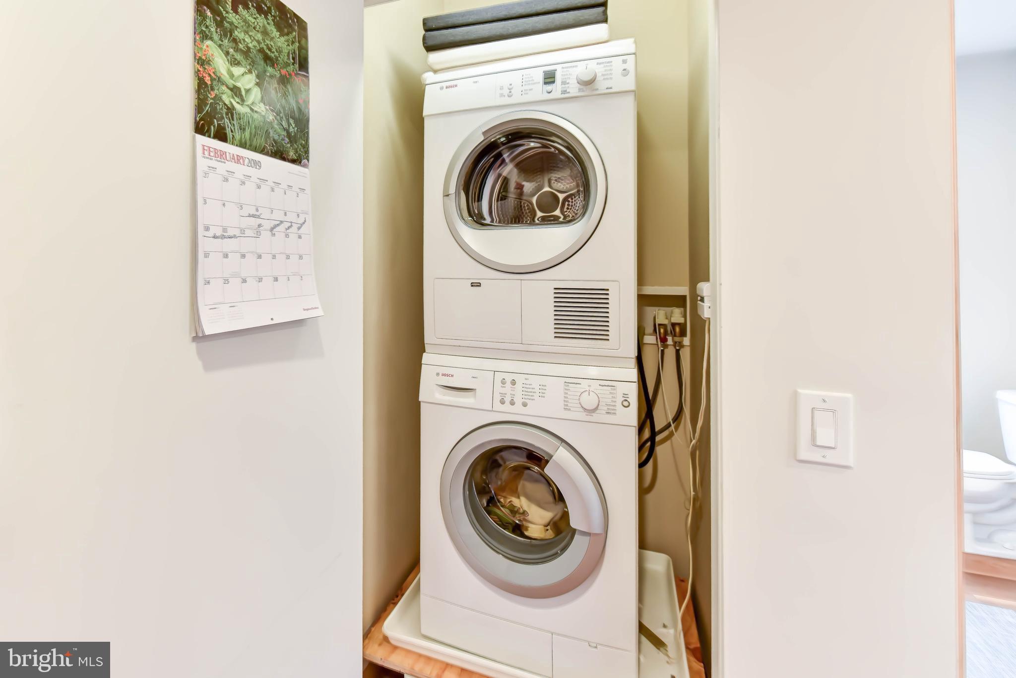 2829 Sacks Street, Unit SA506 Silver Spring, MD 20910 - Photo 21 of 34 a utility room with dryer and washer