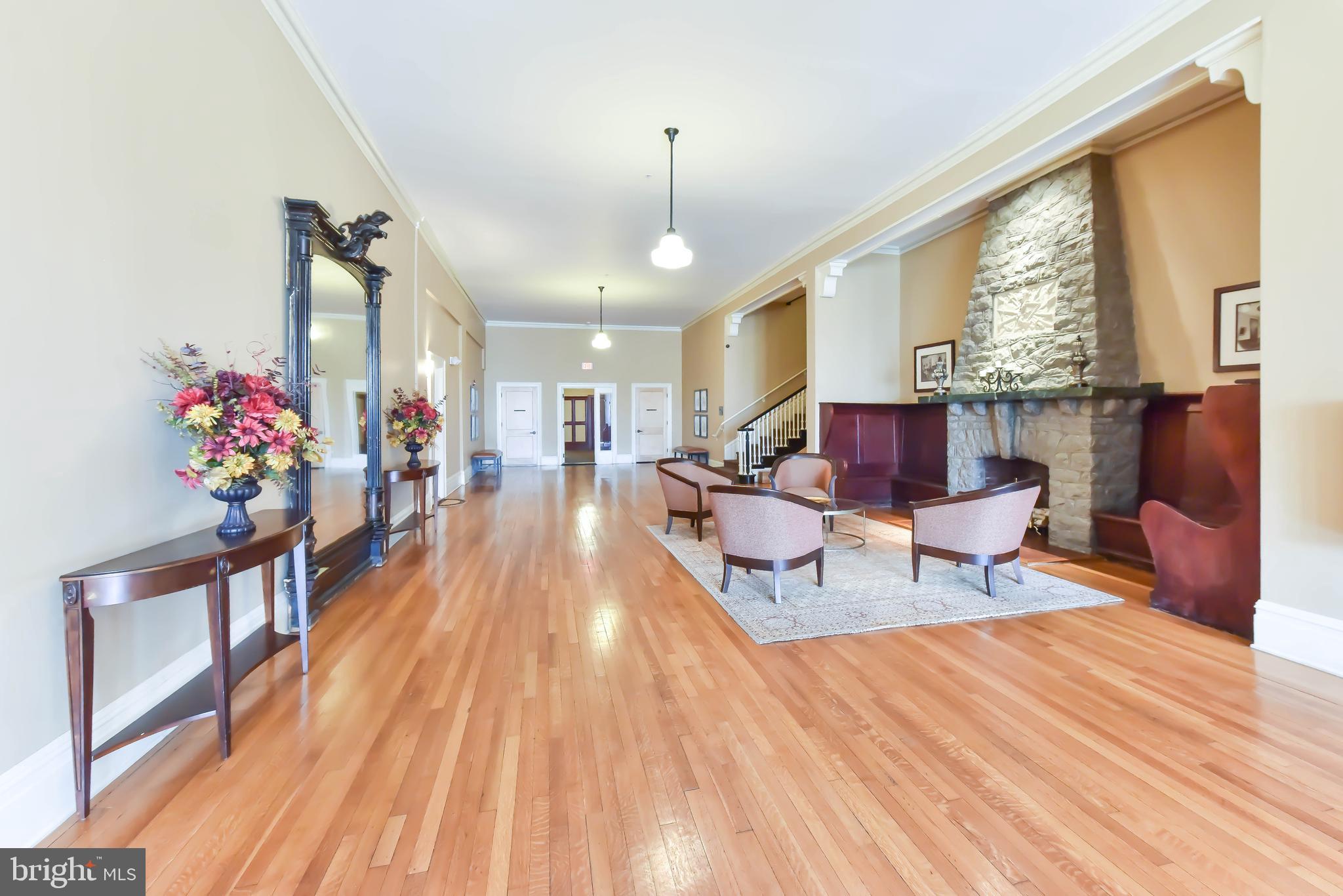 2829 Sacks Street, Unit SA506 Silver Spring, MD 20910 - Photo 25 of 34 a living room filled with furniture and a wooden floor