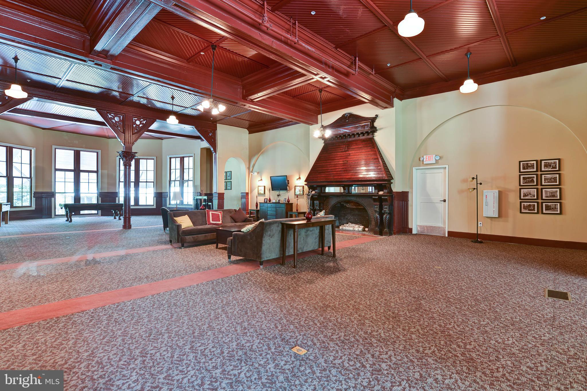2829 Sacks Street, Unit SA506 Silver Spring, MD 20910 - Photo 26 of 34 a room with lots of furniture and a chandelier