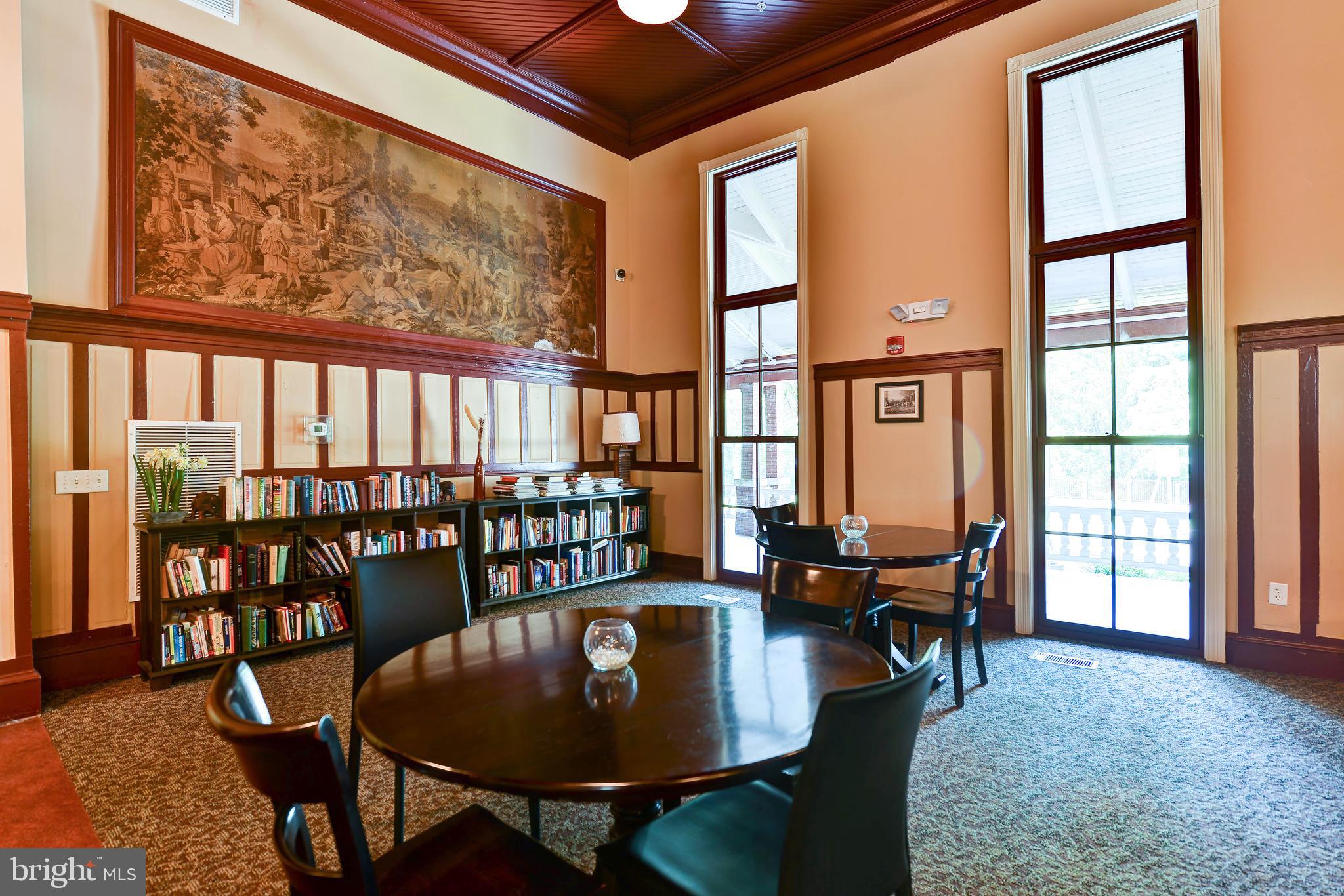 2829 Sacks Street, Unit SA506 Silver Spring, MD 20910 - Photo 27 of 34 a dining room with furniture large windows and wooden floor