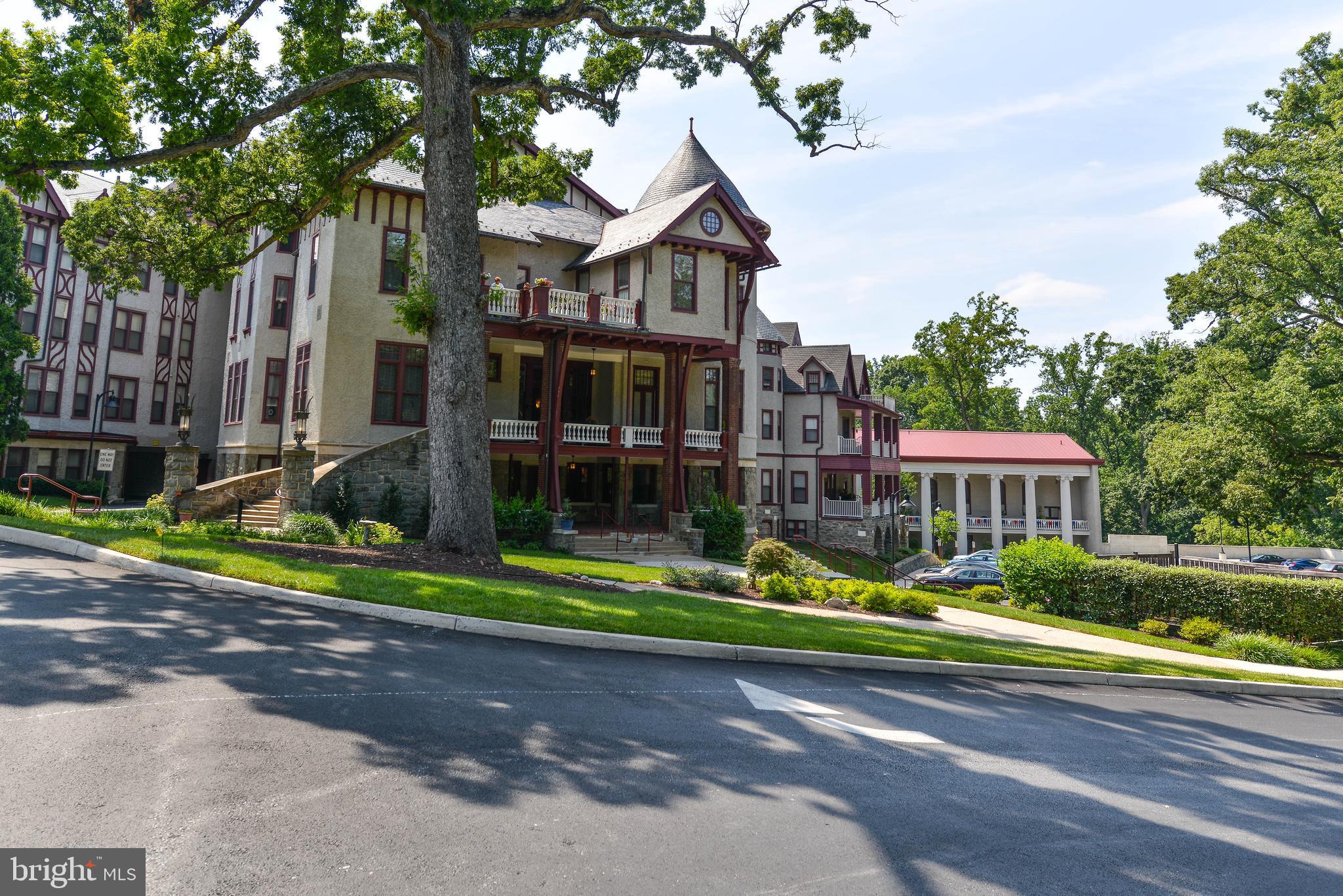2829 Sacks Street, Unit SA506 Silver Spring, MD 20910 - Photo 3 of 34 a front view of a house with garden and trees
