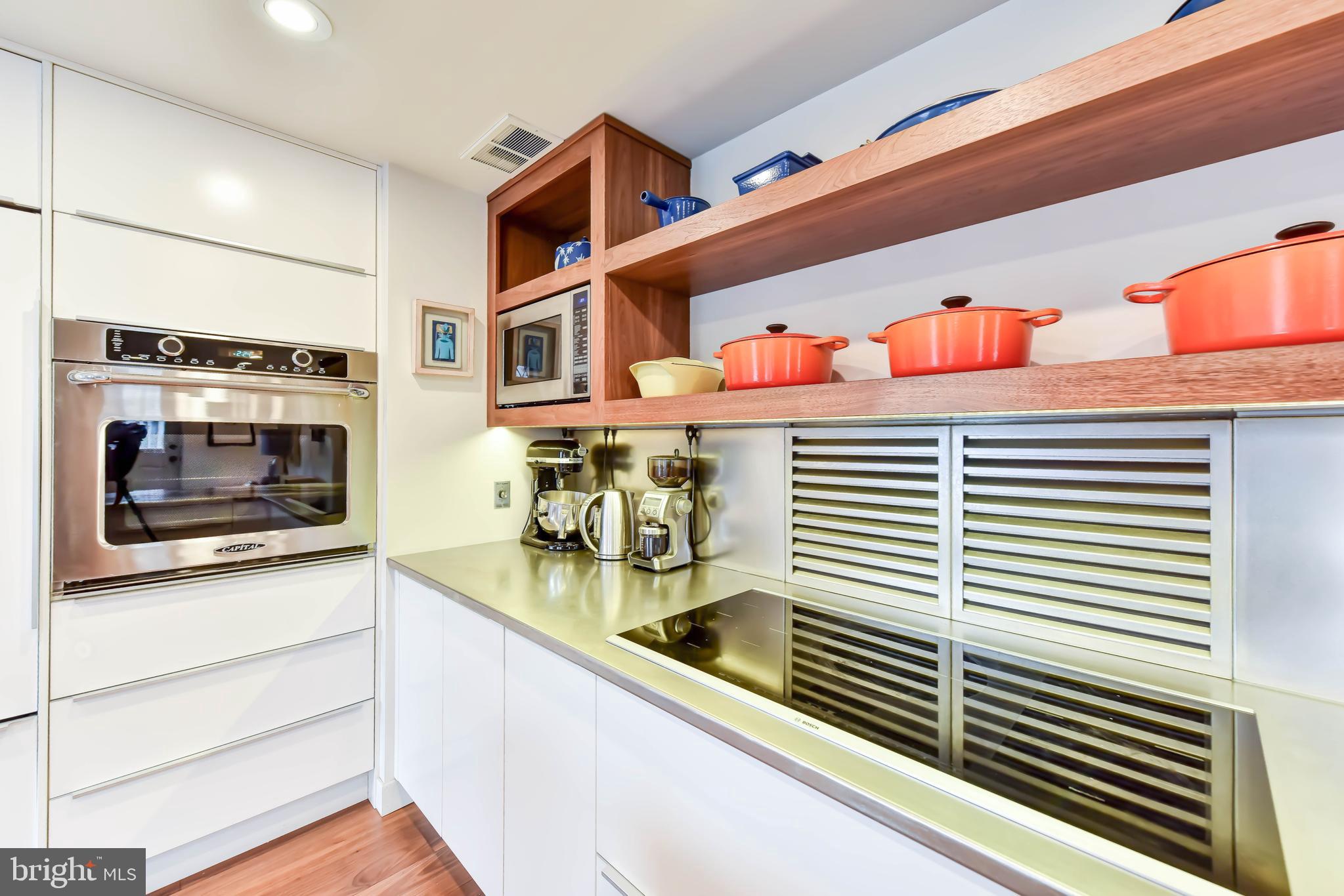 2829 Sacks Street, Unit SA506 Silver Spring, MD 20910 - Photo 6 of 34 a kitchen with stainless steel appliances granite countertop a sink and cabinets