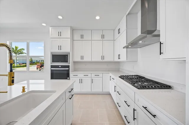 a view of a kitchen with a sink and cabinets