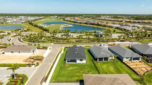 an aerial view of a house with a ocean view