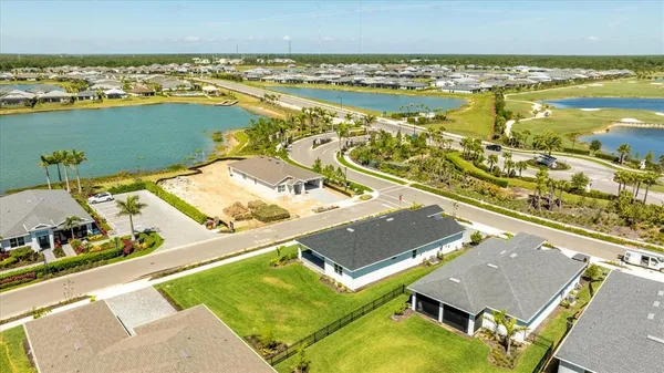 an aerial view of a house with a ocean view