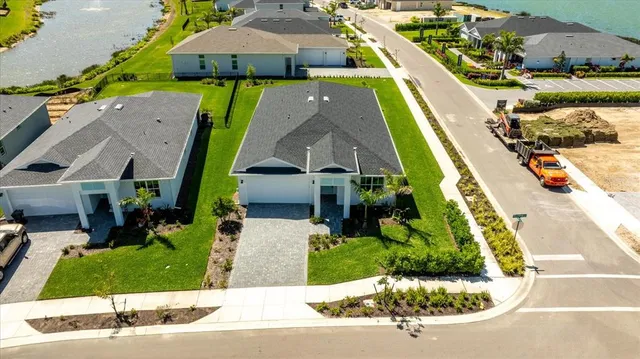 an aerial view of a house with a ocean view