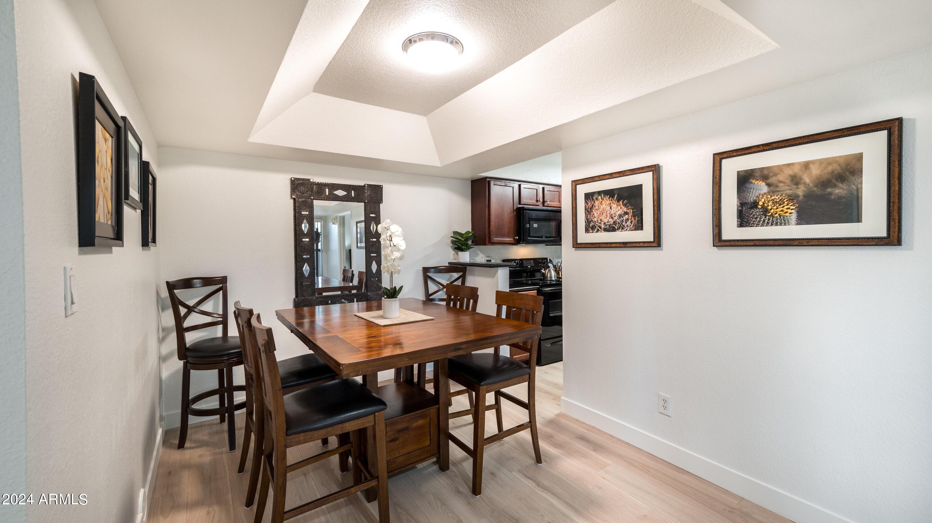 8787 East Mountain View Road, Unit 1034 Scottsdale, AZ 85258 - Photo 15 of 43 a view of a dining room with furniture