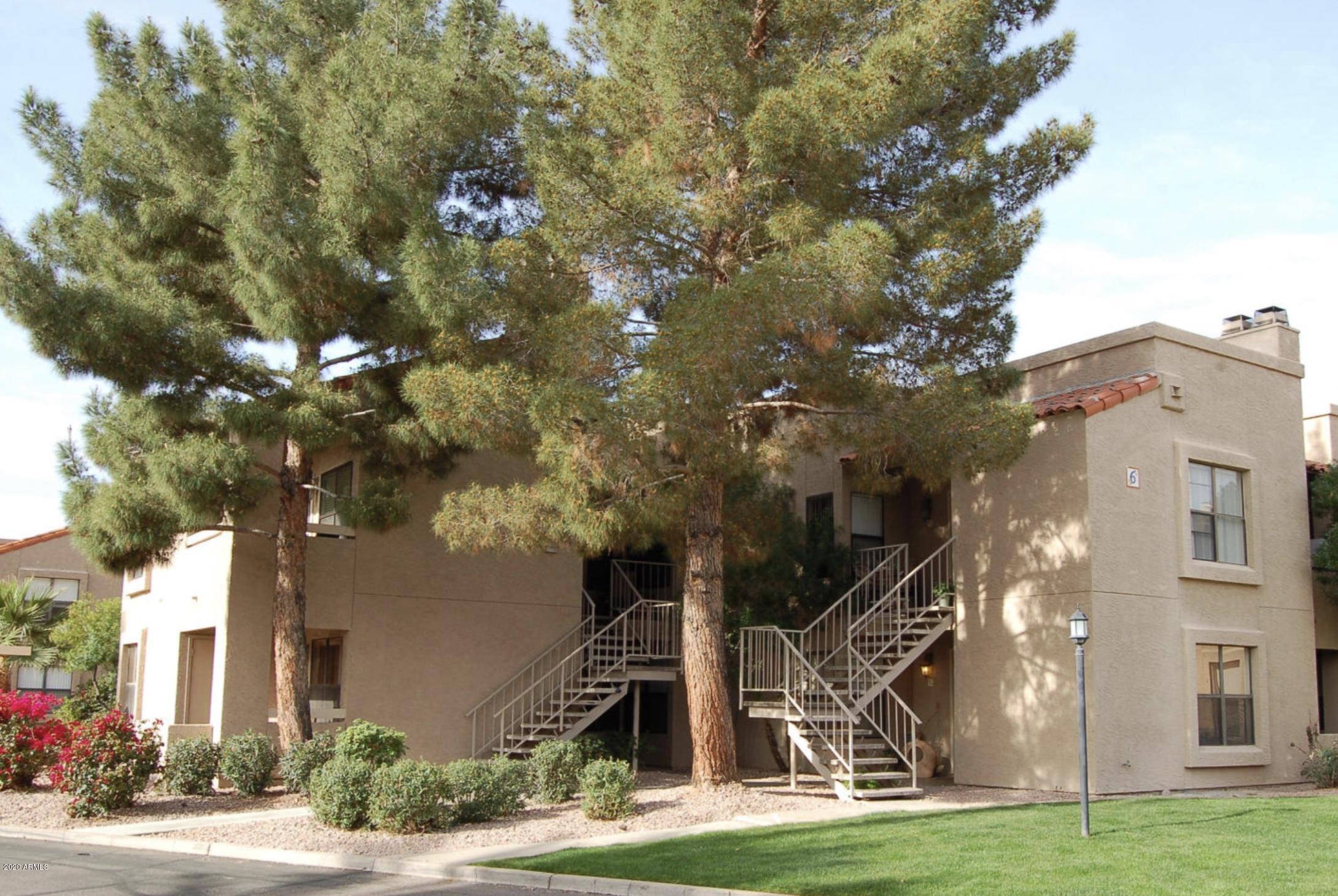 8787 East Mountain View Road, Unit 1034 Scottsdale, AZ 85258 - Photo 2 of 43 a view of a house with a yard