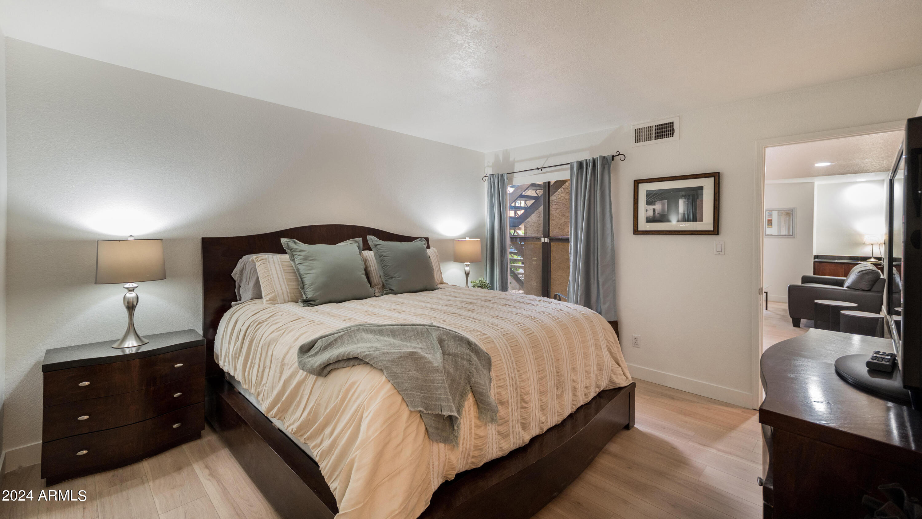 8787 East Mountain View Road, Unit 1034 Scottsdale, AZ 85258 - Photo 21 of 43 a bedroom with a bed and a view of bedroom