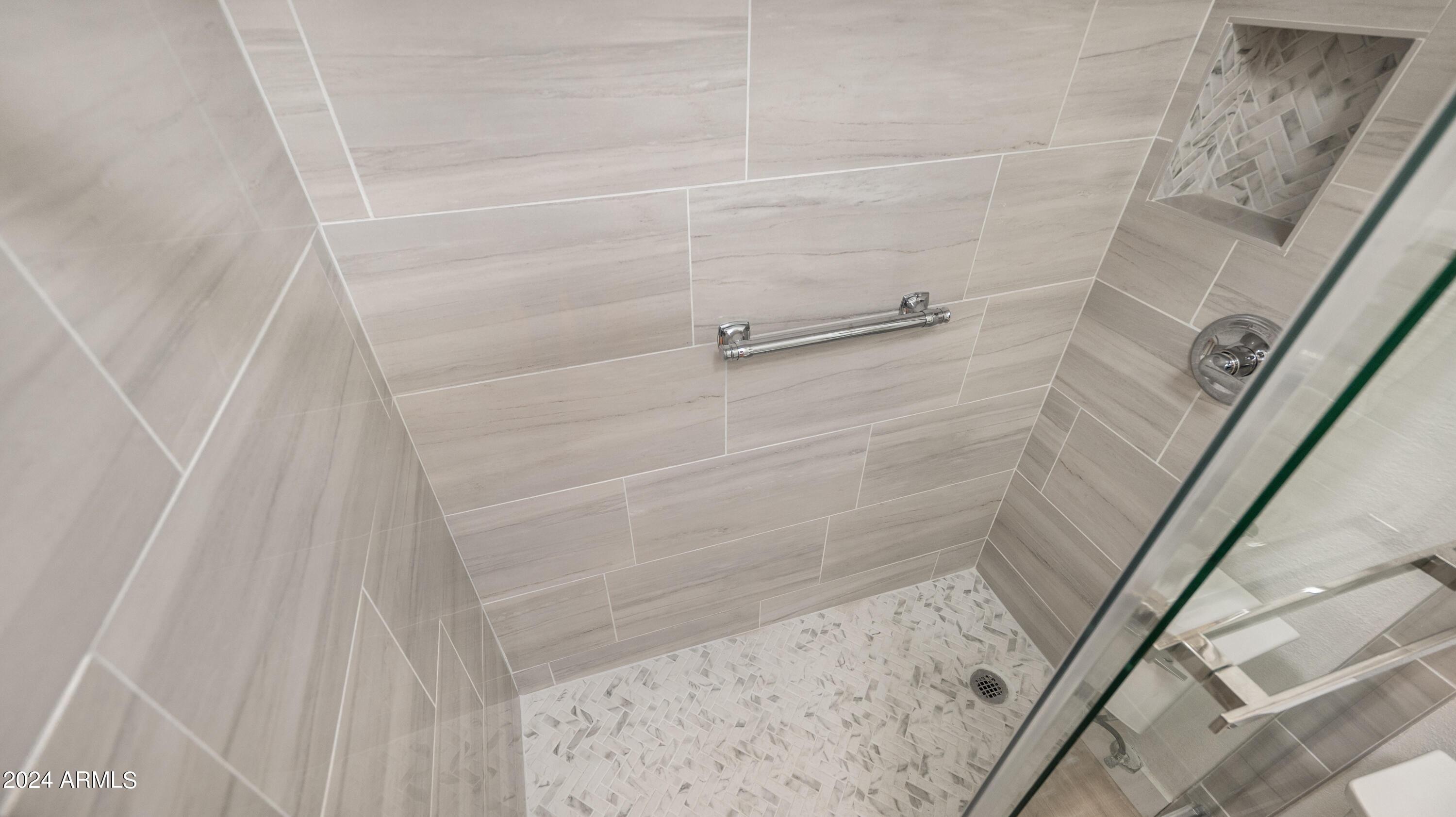 8787 East Mountain View Road, Unit 1034 Scottsdale, AZ 85258 - Photo 22 of 43 a bathroom with a shower