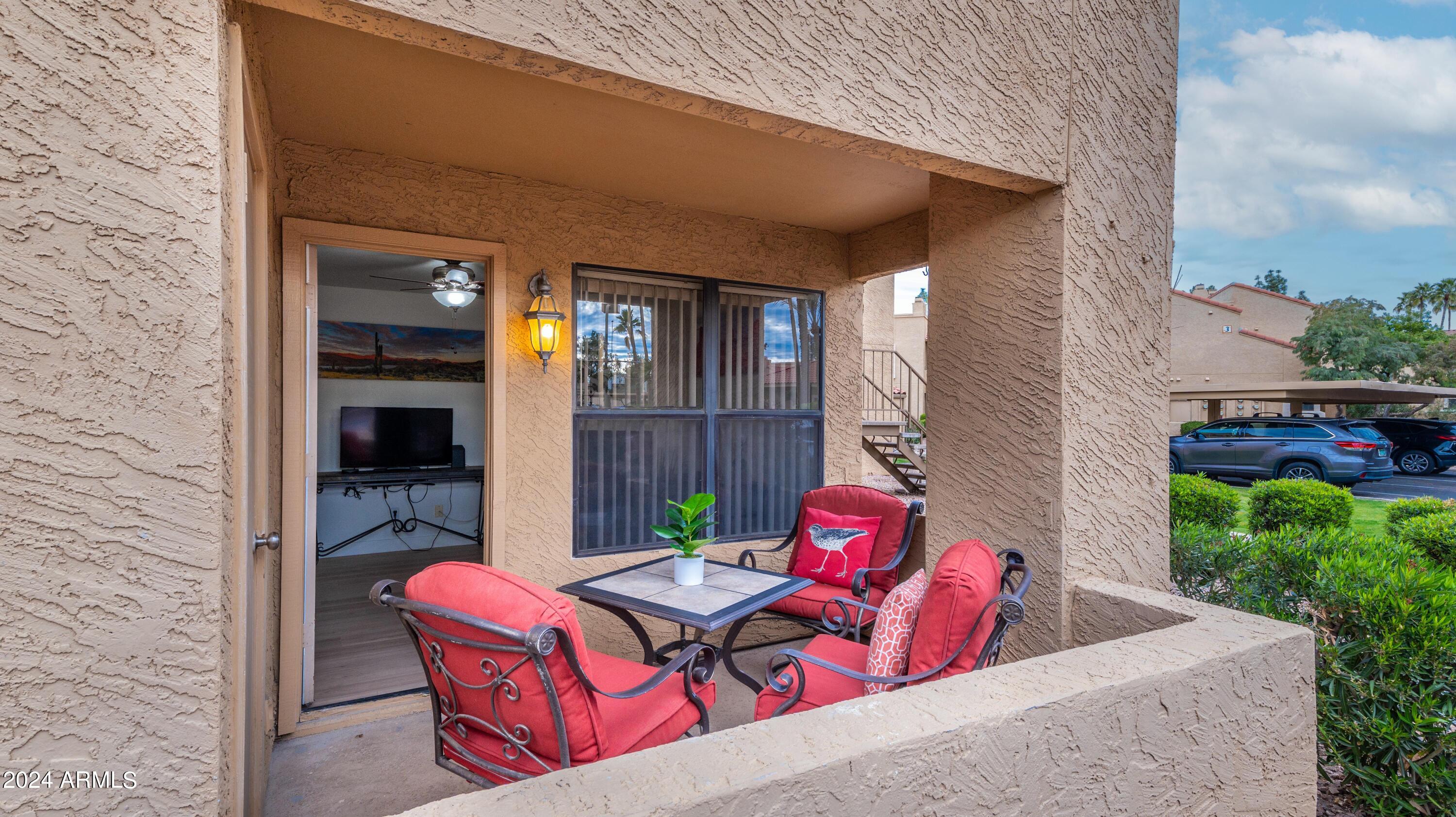 8787 East Mountain View Road, Unit 1034 Scottsdale, AZ 85258 - Photo 28 of 43 a view of backyard with outdoor seating and plants