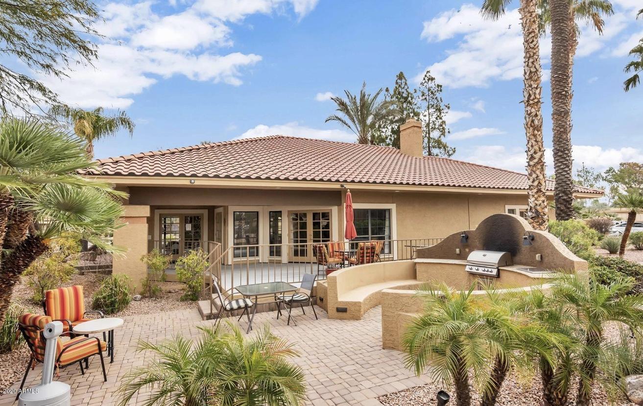 8787 East Mountain View Road, Unit 1034 Scottsdale, AZ 85258 - Photo 38 of 43 a front view of a house with patio