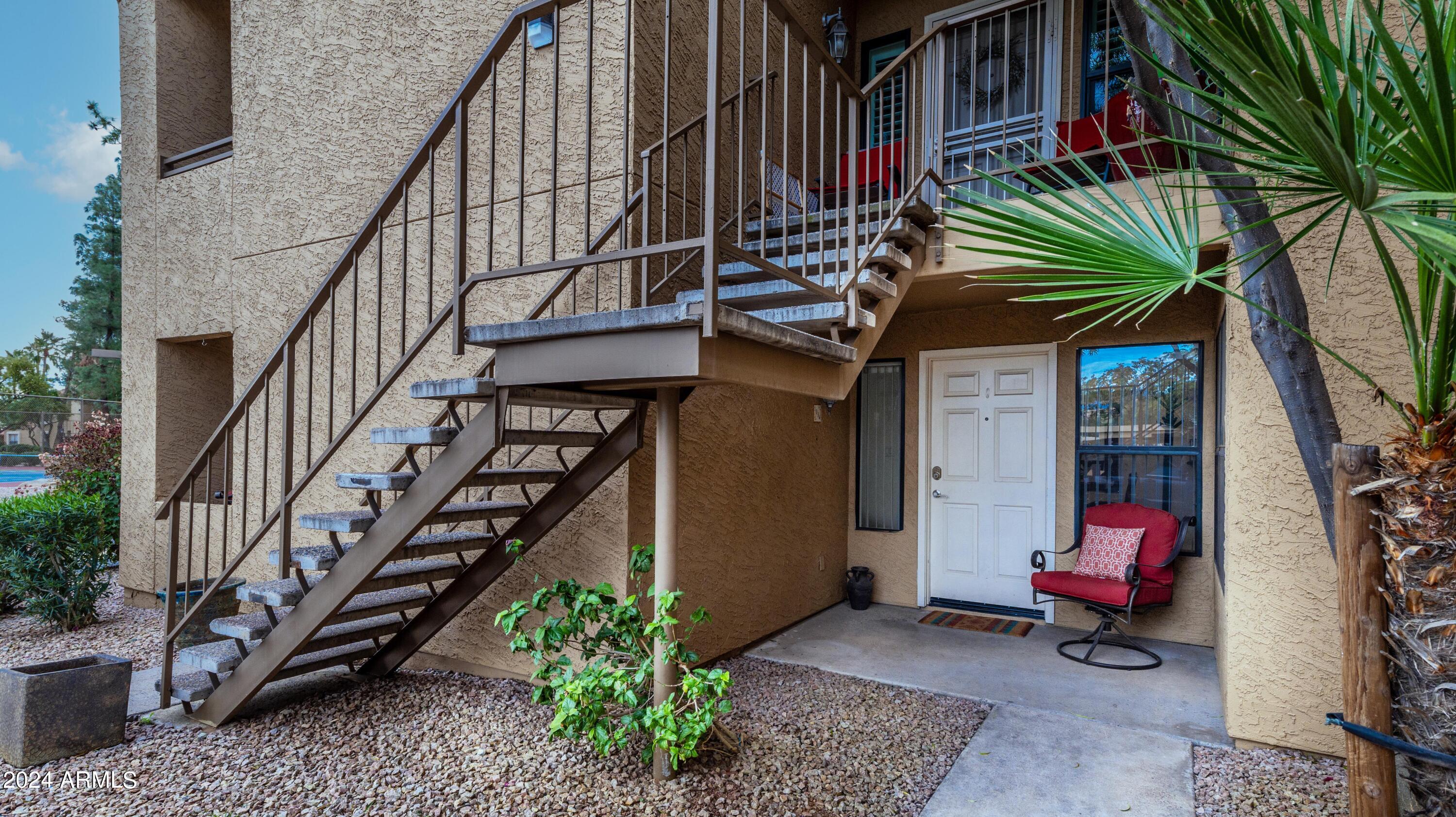 8787 East Mountain View Road, Unit 1034 Scottsdale, AZ 85258 - Photo 4 of 43 a view of entryway with wooden stairs