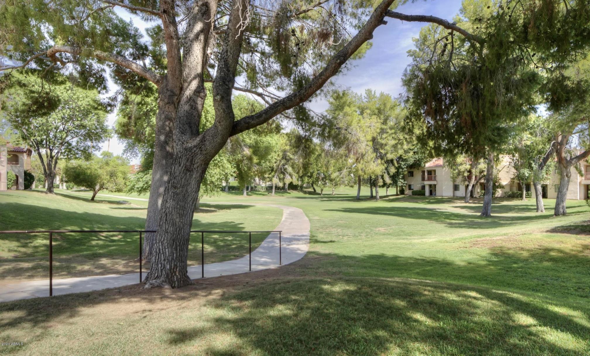 8787 East Mountain View Road, Unit 1034 Scottsdale, AZ 85258 - Photo 42 of 43 a garden view with a fountain