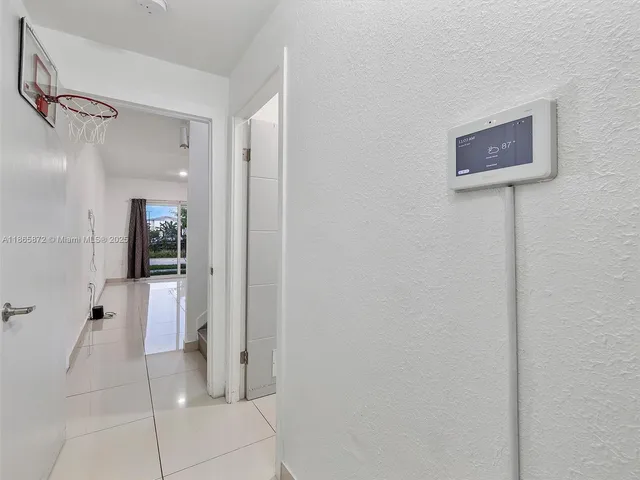 a bedroom with a bed window and dresser