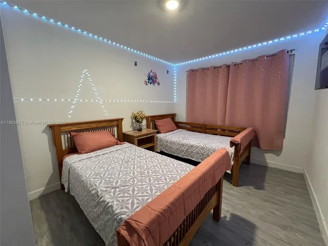 a living room with furniture and a piano