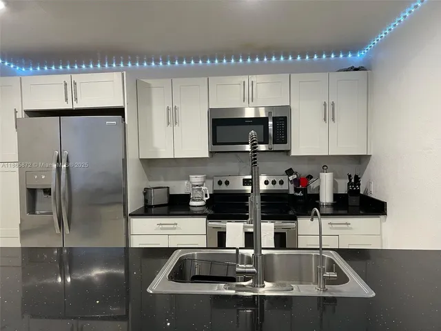 a living room with furniture a window and gym equipment