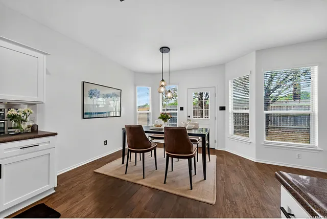 a view of a dining room with furniture window and wooden floor