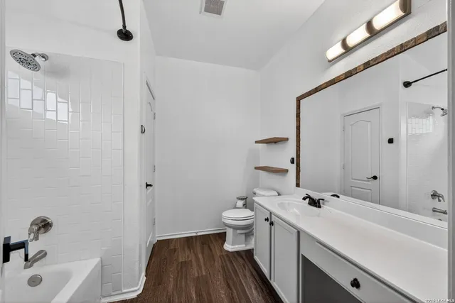 a bathroom with a sink and a large mirror