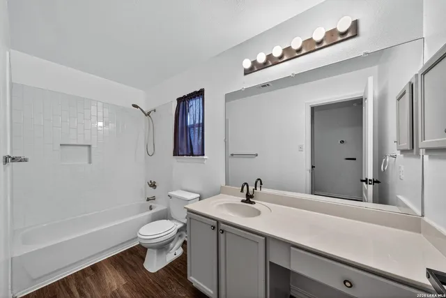 a bathroom with a sink a toilet and a bathtub