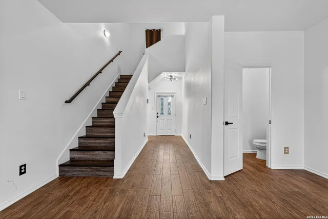 a view of entryway with wooden floor