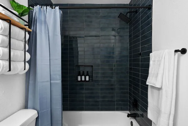 a bathroom with a shower and a toilet