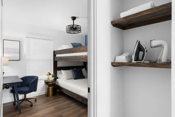 a bedroom with a bed and a chair