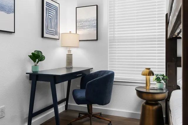 a view of a workspace with furniture