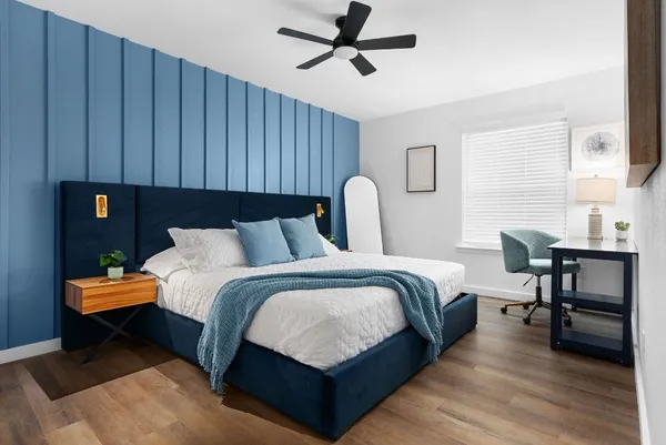 a bed room with a bed window and a table