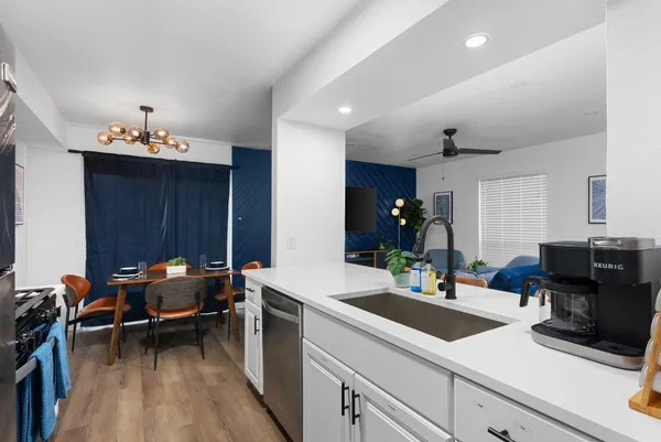 a kitchen with a sink and cabinets