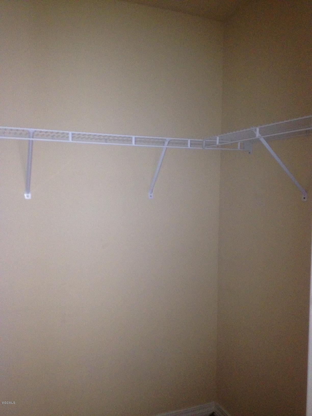 16089 Cook Road, Unit A B C D Biloxi, MS 39532 - Photo 8 of 24 MASTER BR CLOSET