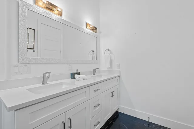 a bathroom with a sink and a mirror