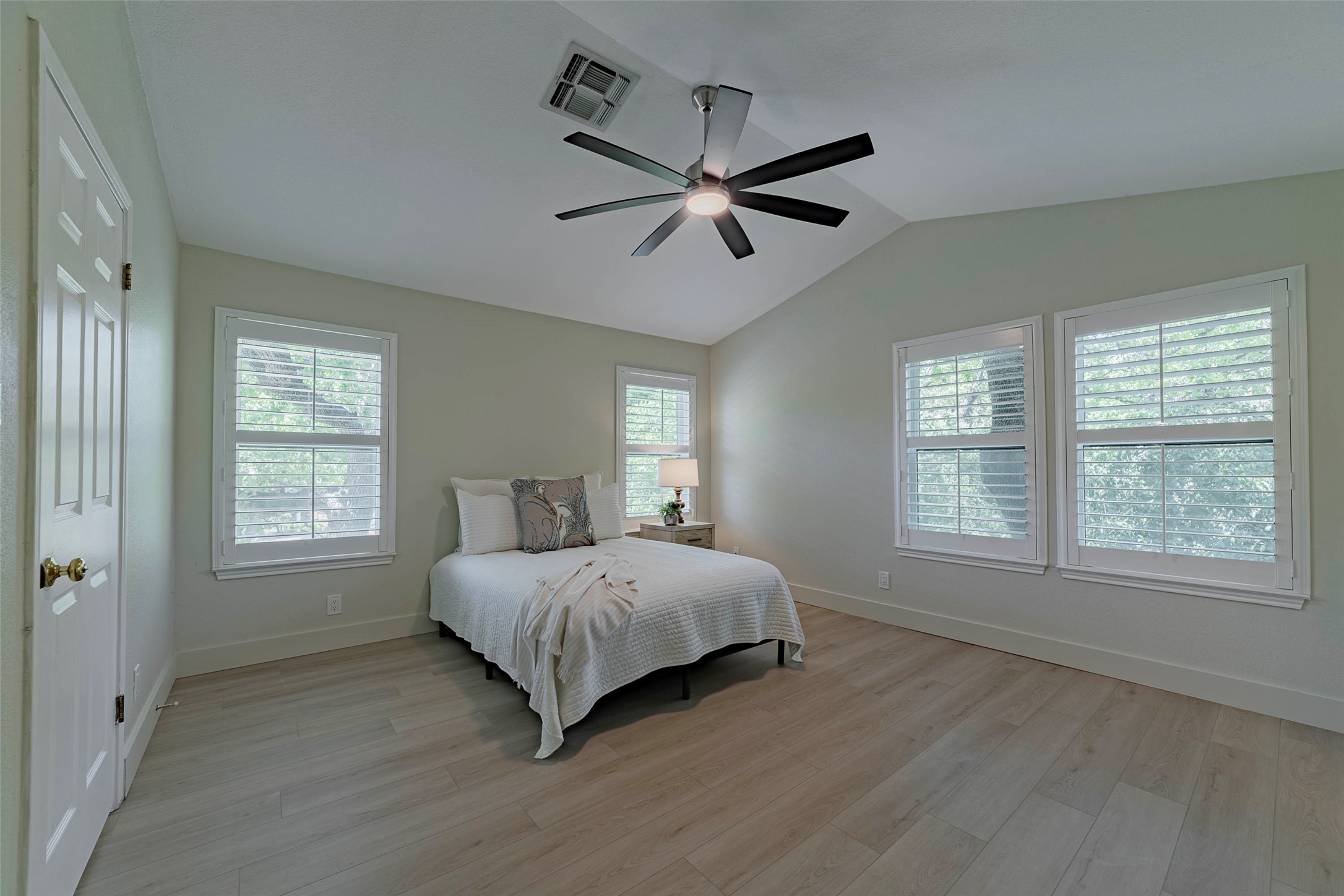 2500 Quarry Road, Unit 5 Austin, TX 78703 - Photo 10 of 23 a spacious bedroom with a bed a window and closet
