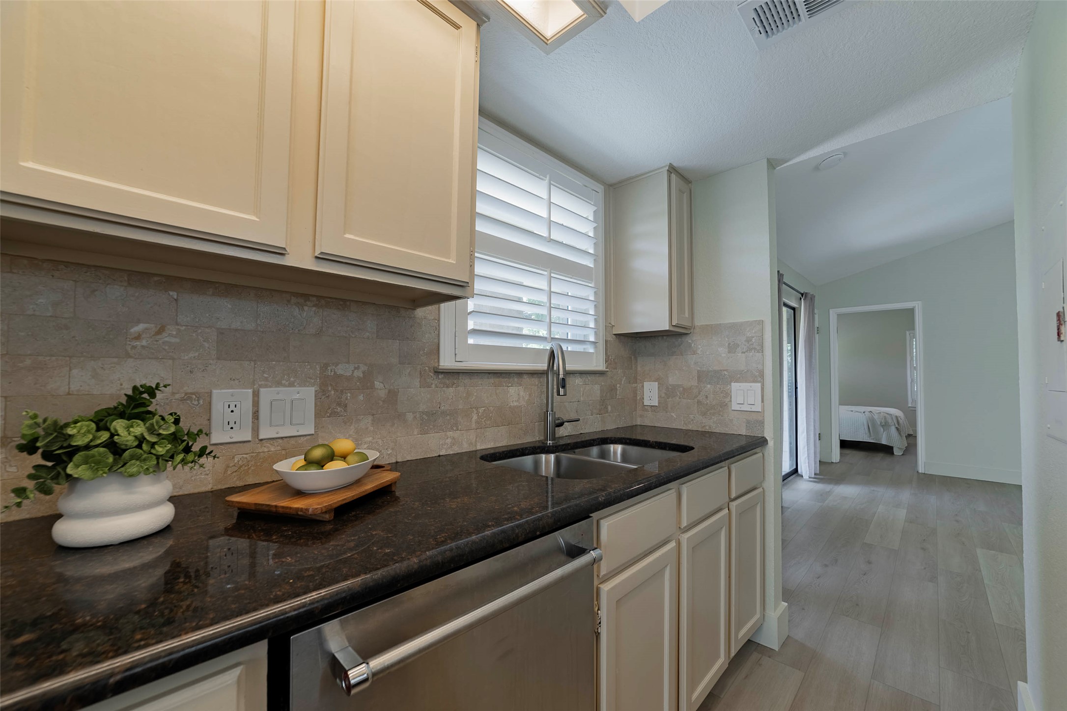 2500 Quarry Road, Unit 5 Austin, TX 78703 - Photo 9 of 23 a kitchen with a sink and cabinets