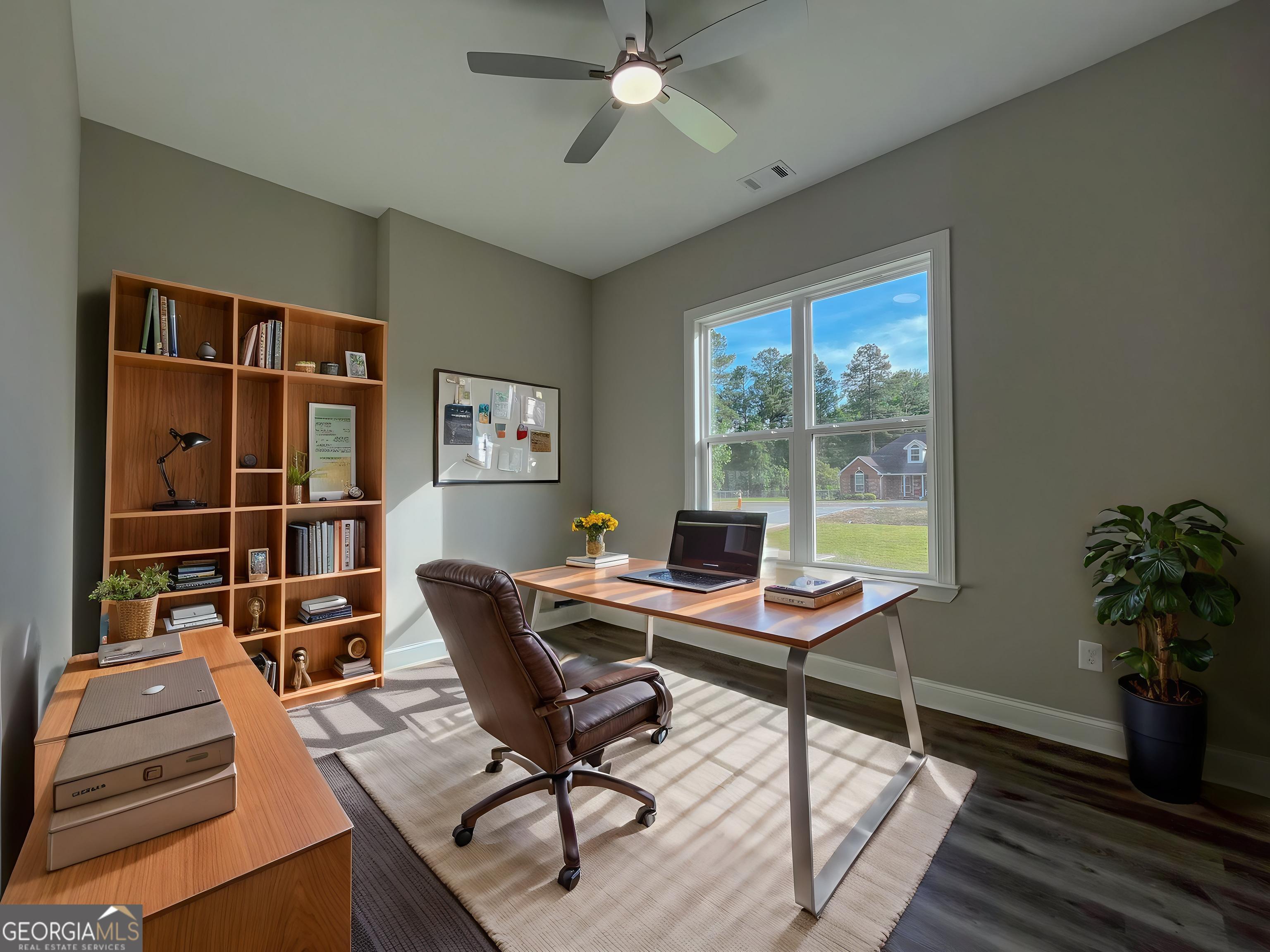 711 Flanders Lane Dublin, GA 31021 - Photo 30 of 49 a view of a workspace with furniture and a window