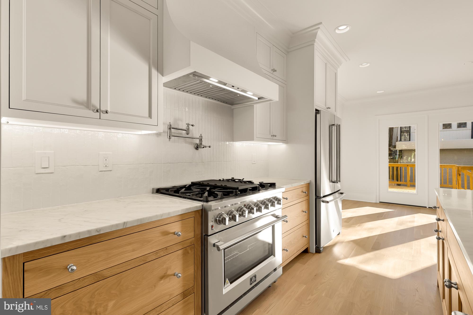 1412 Perry Place Northwest Washington, DC 20010 - Photo 14 of 52 a kitchen with stainless steel appliances granite countertop a stove and a refrigerator