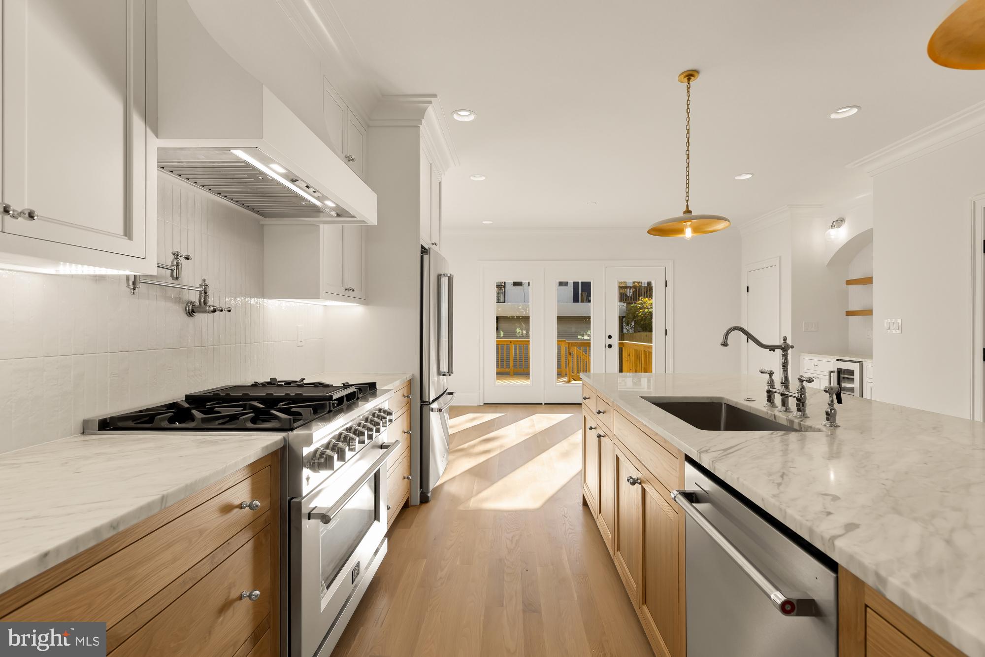 1412 Perry Place Northwest Washington, DC 20010 - Photo 15 of 52 a kitchen with granite countertop a stove and a sink