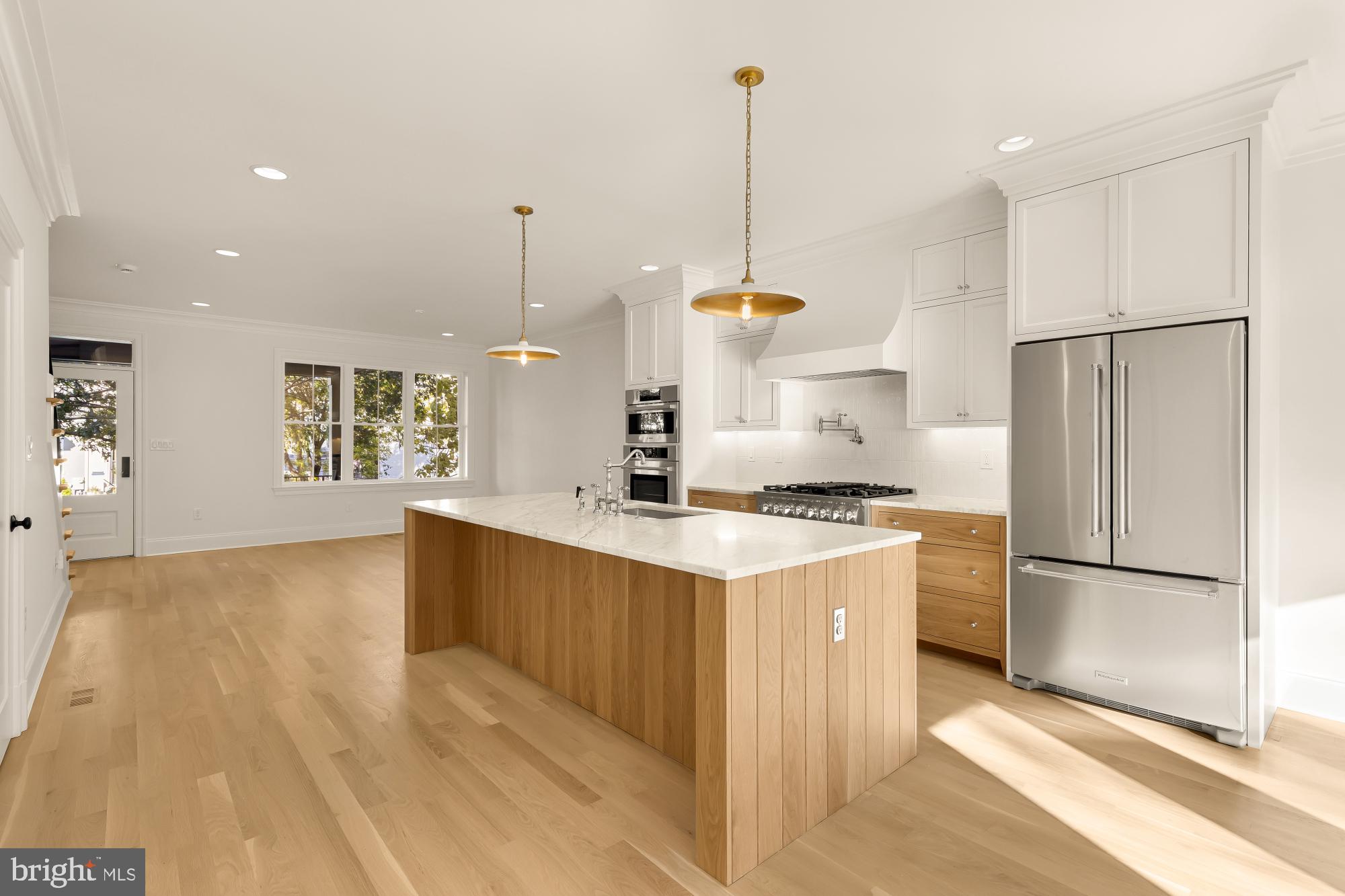 1412 Perry Place Northwest Washington, DC 20010 - Photo 17 of 52 a kitchen with stainless steel appliances granite countertop a refrigerator a sink and a stove