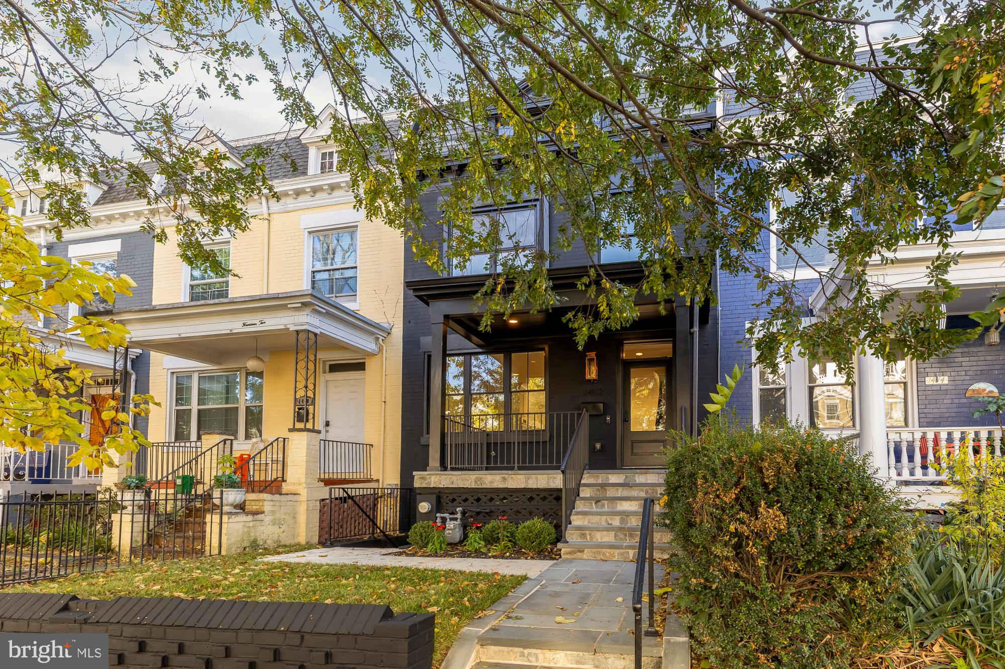 1412 Perry Place Northwest Washington, DC 20010 - Photo 2 of 52 a front view of a building with a tree