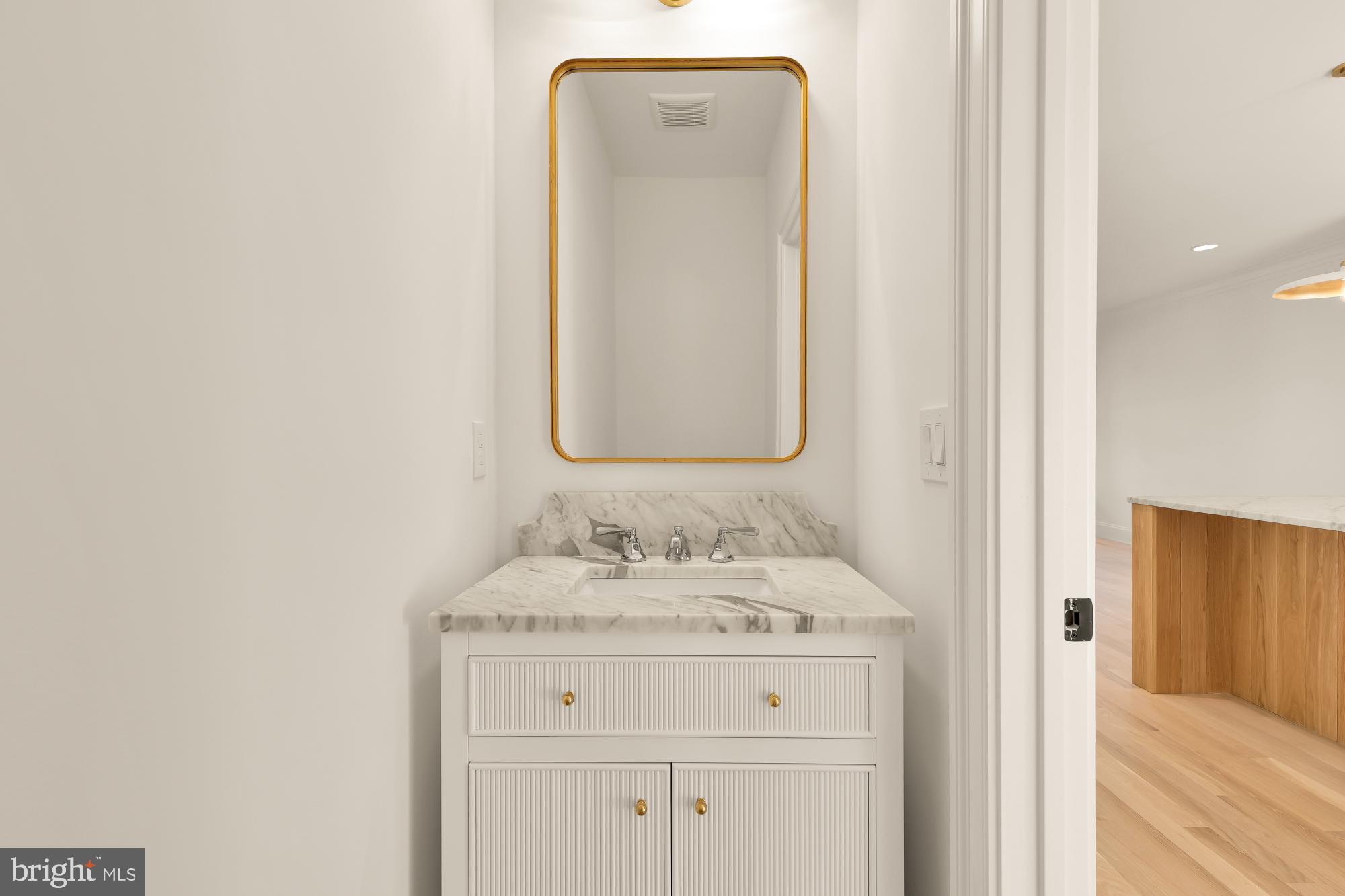 1412 Perry Place Northwest Washington, DC 20010 - Photo 25 of 52 a bathroom with a sink and a mirror