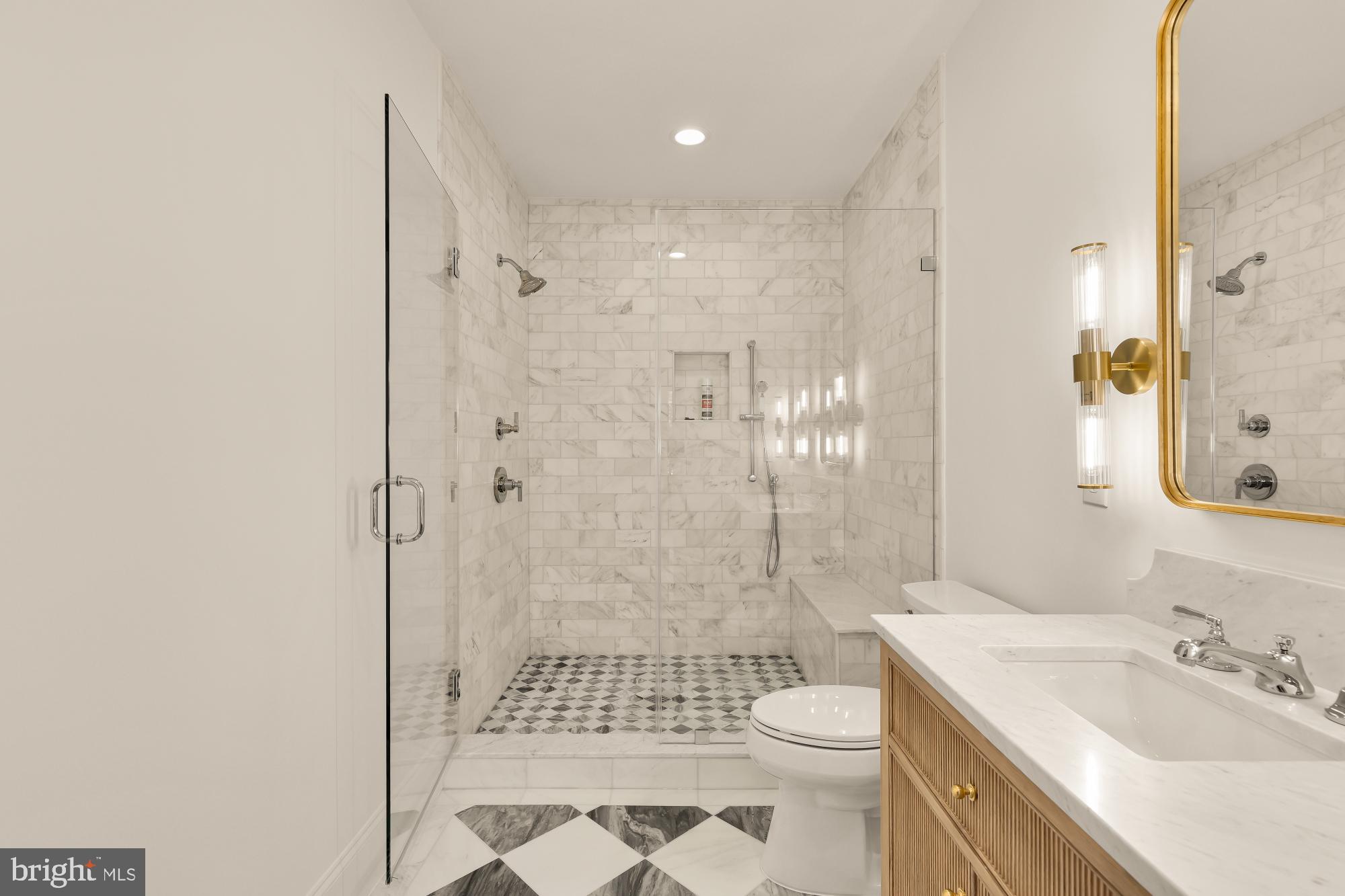 1412 Perry Place Northwest Washington, DC 20010 - Photo 30 of 52 a bathroom with a sink a toilet and shower