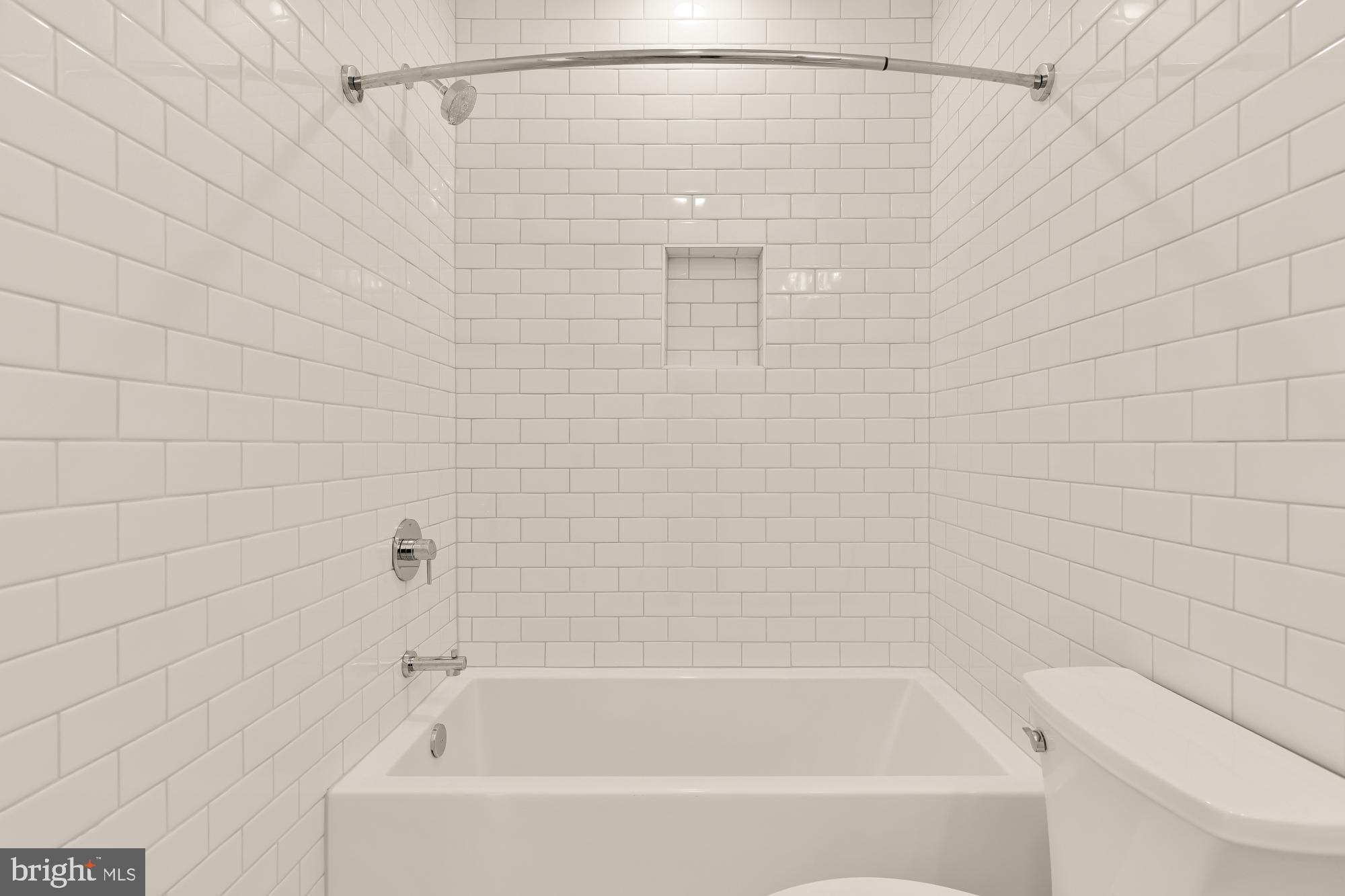 1412 Perry Place Northwest Washington, DC 20010 - Photo 33 of 52 a bathroom with a shower and a bath tub