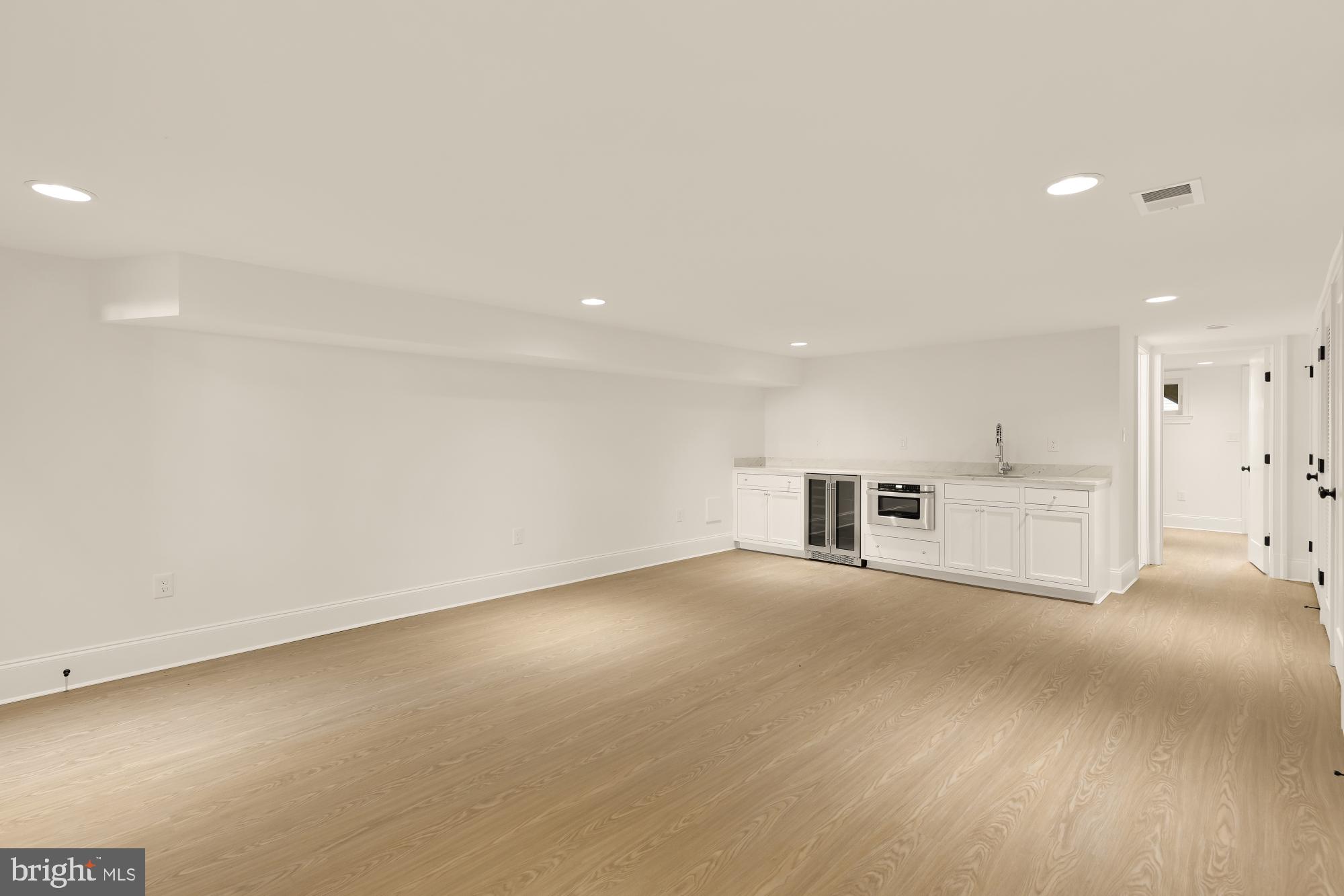 1412 Perry Place Northwest Washington, DC 20010 - Photo 38 of 52 a view of empty room with wooden floor