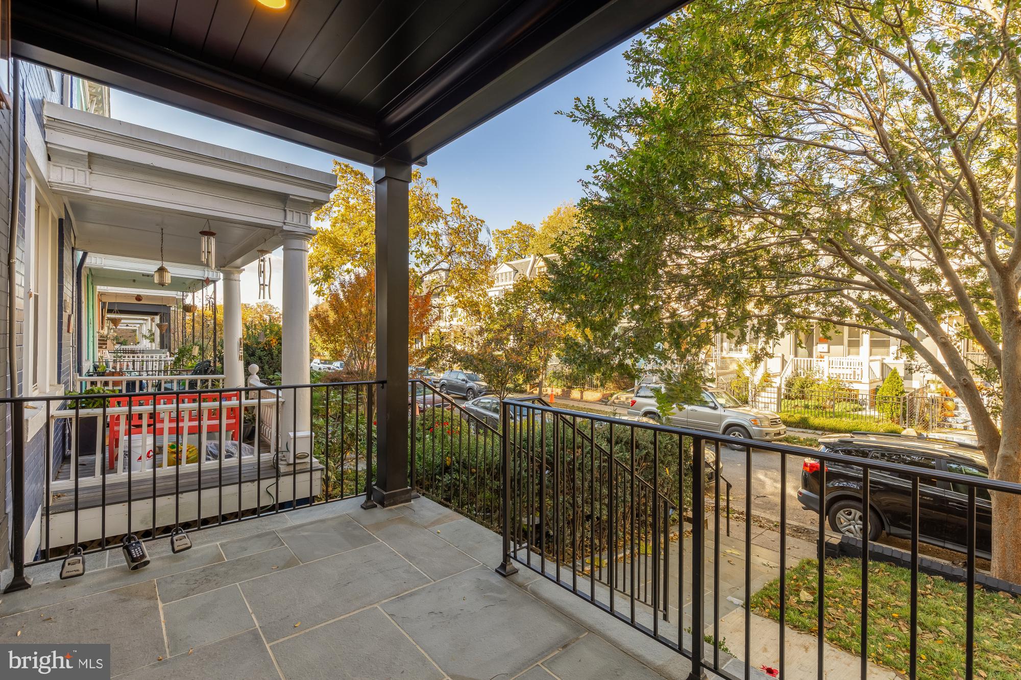 1412 Perry Place Northwest Washington, DC 20010 - Photo 5 of 52 a view of a porch with wooden floor and fence