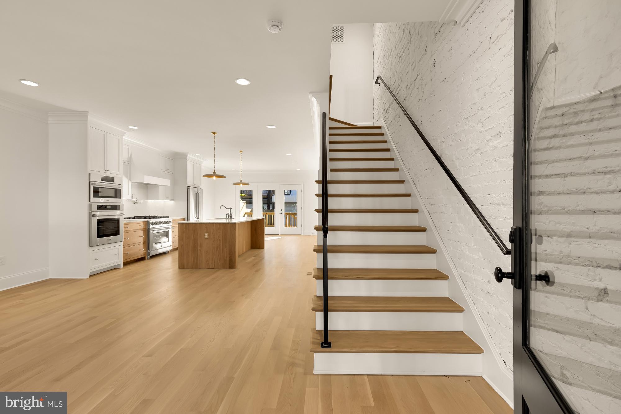 1412 Perry Place Northwest Washington, DC 20010 - Photo 6 of 52 a view of kitchen with wooden floor and electronic appliances